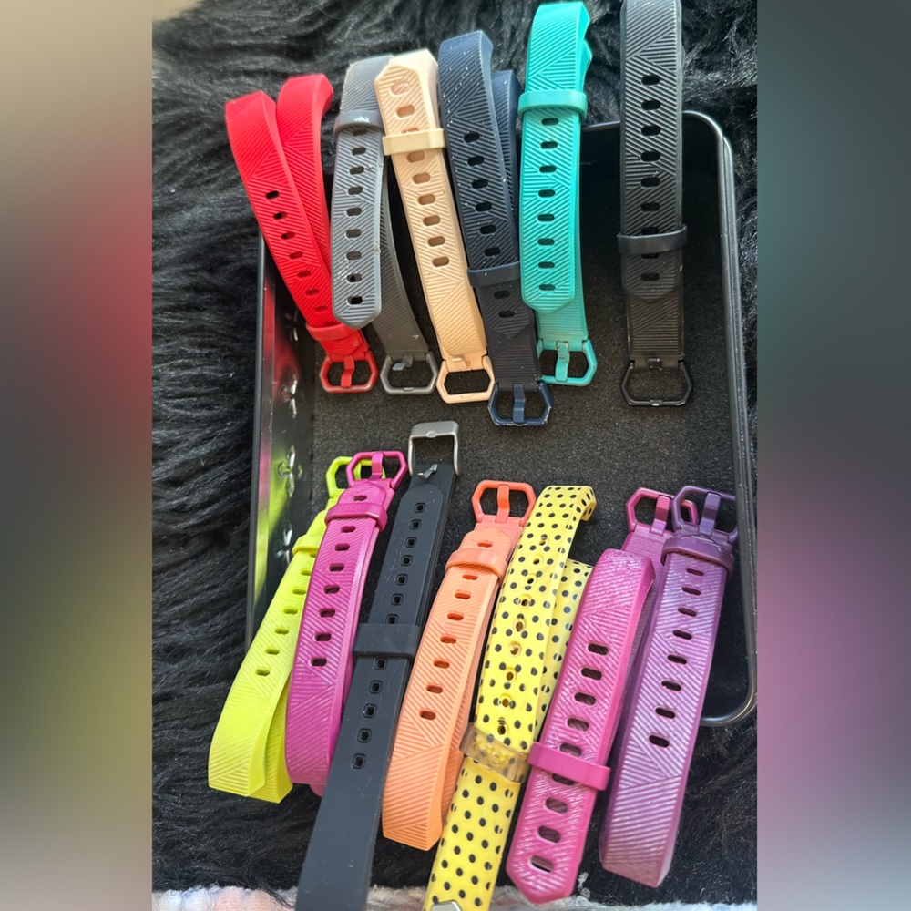 Fit Bit with charger and 16 watch straps for sports or formal styles